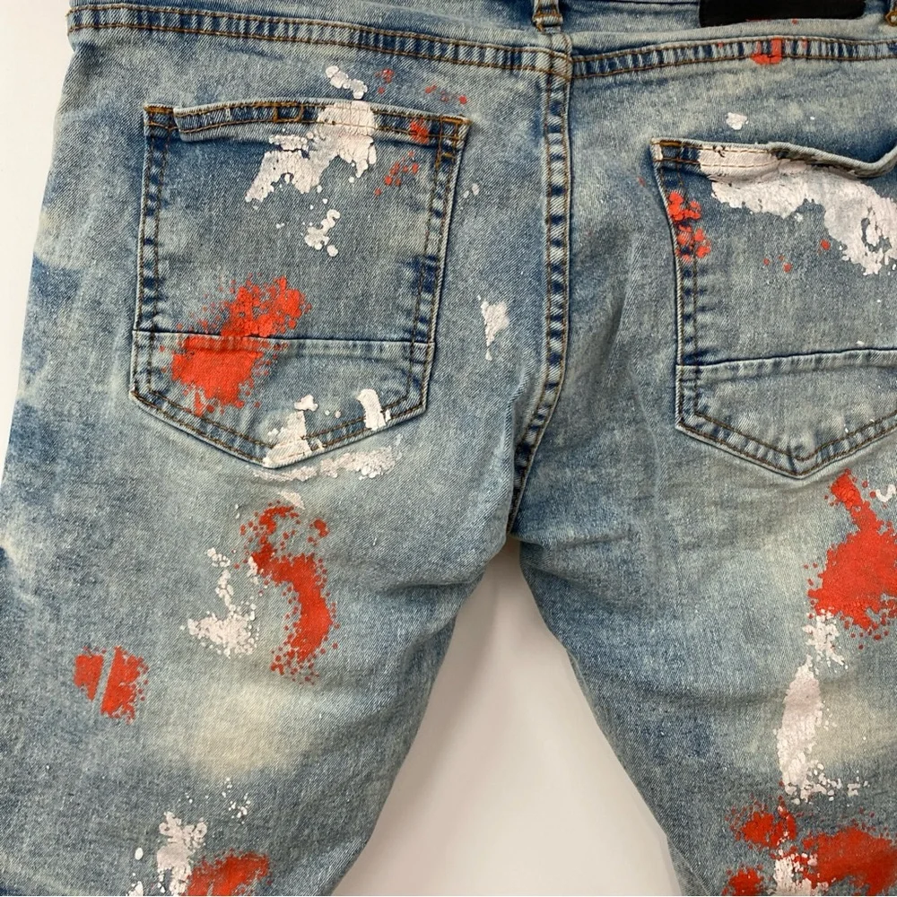Distressed Paint-Splatter Men’s Denim Shorts in Blue with Red Accents